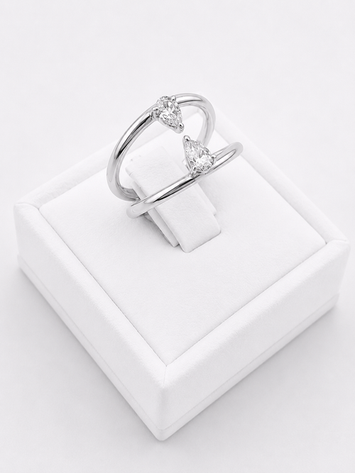 Ring With Two Lines And Two Pear Cut Diamonds