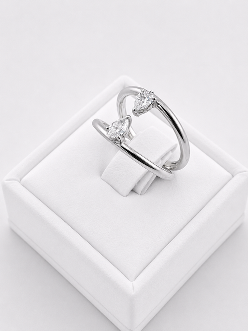 Ring With Two Lines And Two Pear Cut Diamonds
